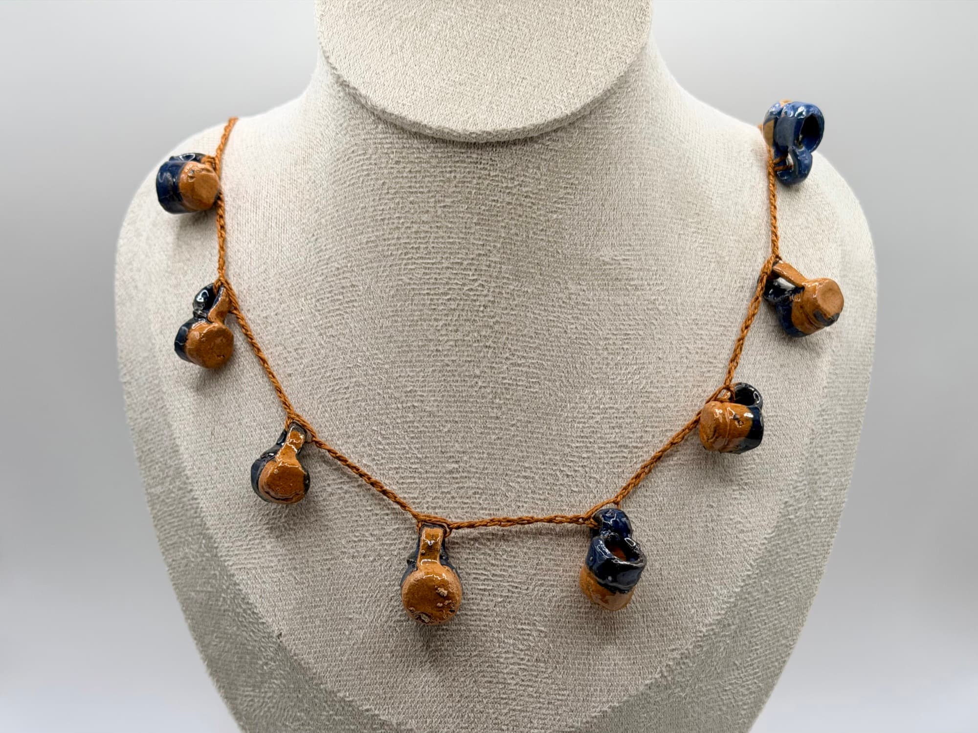 Closer view of Agua del Río on a necklace bust.