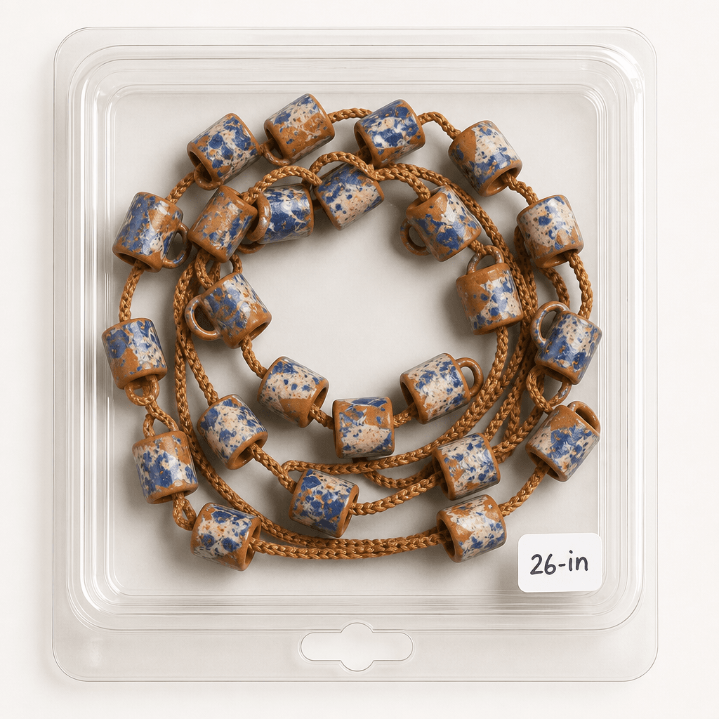Luna de Barro shown coiled in its clear retail package, labeled by hand.